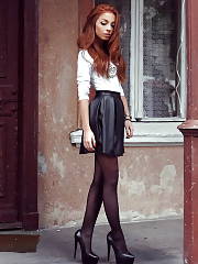 Redhead Rookie In Flared Leather Skirt And Black Pumps