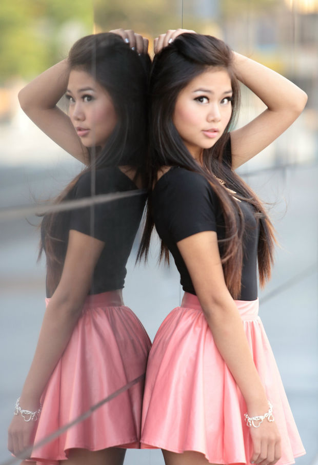 Sweet Asian In A Black Top And Pink Skirt