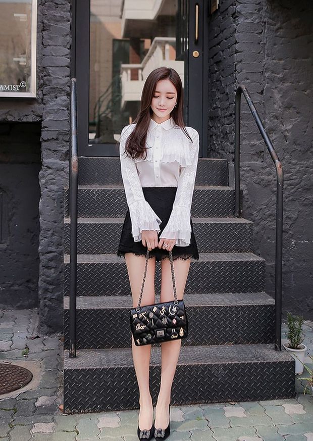 Sweet Asian In A White Blouse And Black Skirt